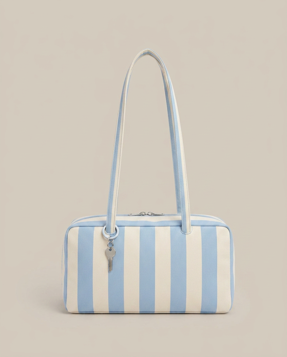 Blue and cream striped canvas bowler bag with zip closure and silver key charm